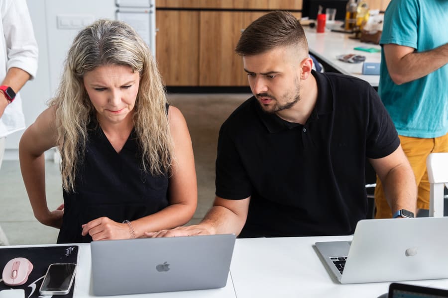 Two Town Web team members working through a request together