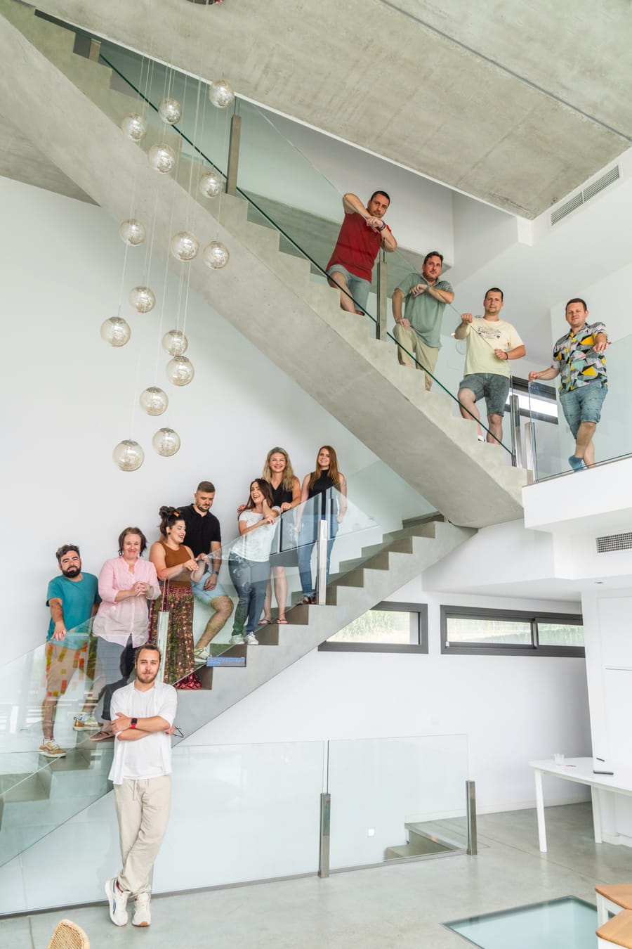 The Town Web team gathered on the office staircase